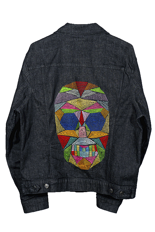 Flaca hand-embroidered denim jacket, full back view with the geometric mask design on a heavyweight Levi's trucker jacket