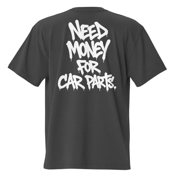Oversized T-shirt in faded black, back view with NEED MONEY FOR CAR PARTS hand-lettered across four lines in dripping white paint